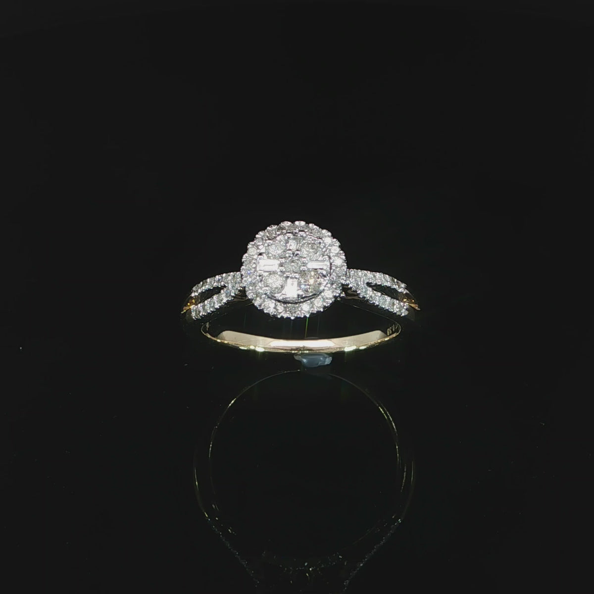 Angled video of a 10K yellow gold 0.40 CTW diamond halo ring with open split shoulders.