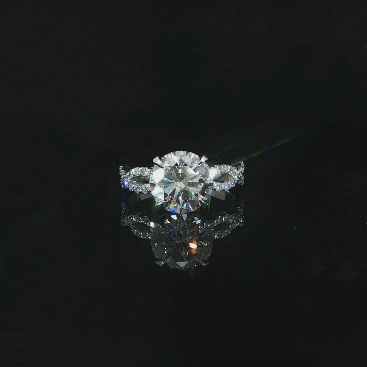 Video of a 14K white gold ring with a 3.07 CT round lab-grown diamond and infinity twist band.