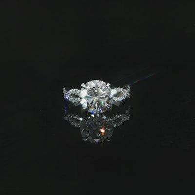 Video of a 14K white gold ring with a 3.07 CT round lab-grown diamond and infinity twist band.