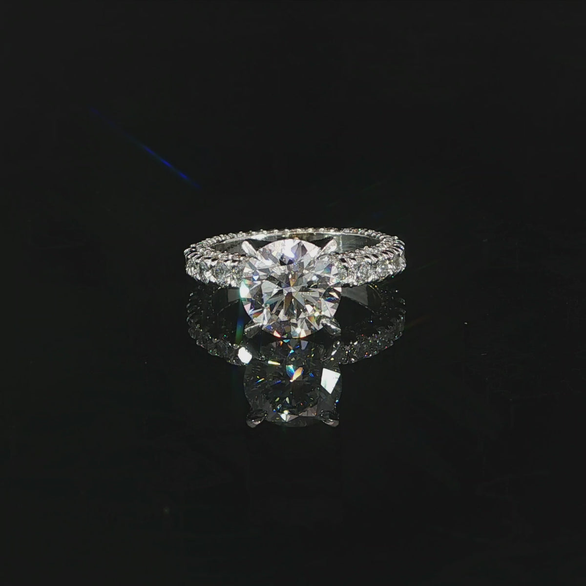 Video of 18K white gold diamond engagement ring round 2.70ct center with eternity band and diamonds on all sides.