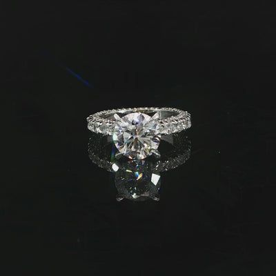 Video of 18K white gold diamond engagement ring round 2.70ct center with eternity band and diamonds on all sides.