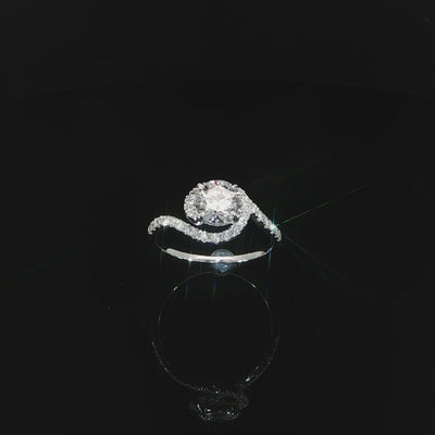Angled video showing the transition from diamond-set shoulders to the polished white gold band.