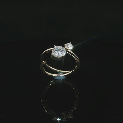 Angled video of two-stone diamond ring with 14k yellow gold band wrapping around