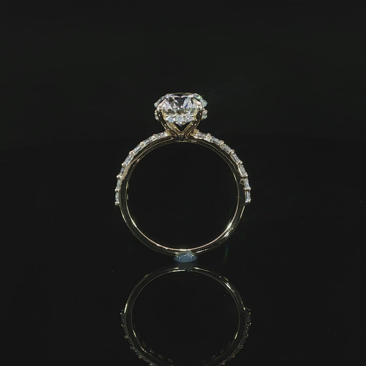 Yellow gold ring featuring an E color, VS1 clarity round lab-grown center diamond with a hidden halo.