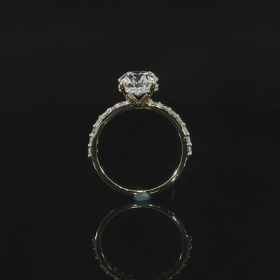 Yellow gold ring featuring an E color, VS1 clarity round lab-grown center diamond with a hidden halo.