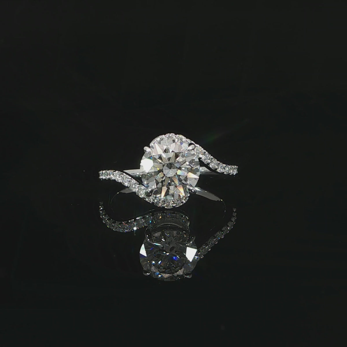 Bypass engagement ring with 2.30 total carats of lab-grown diamonds set in 14K white gold.