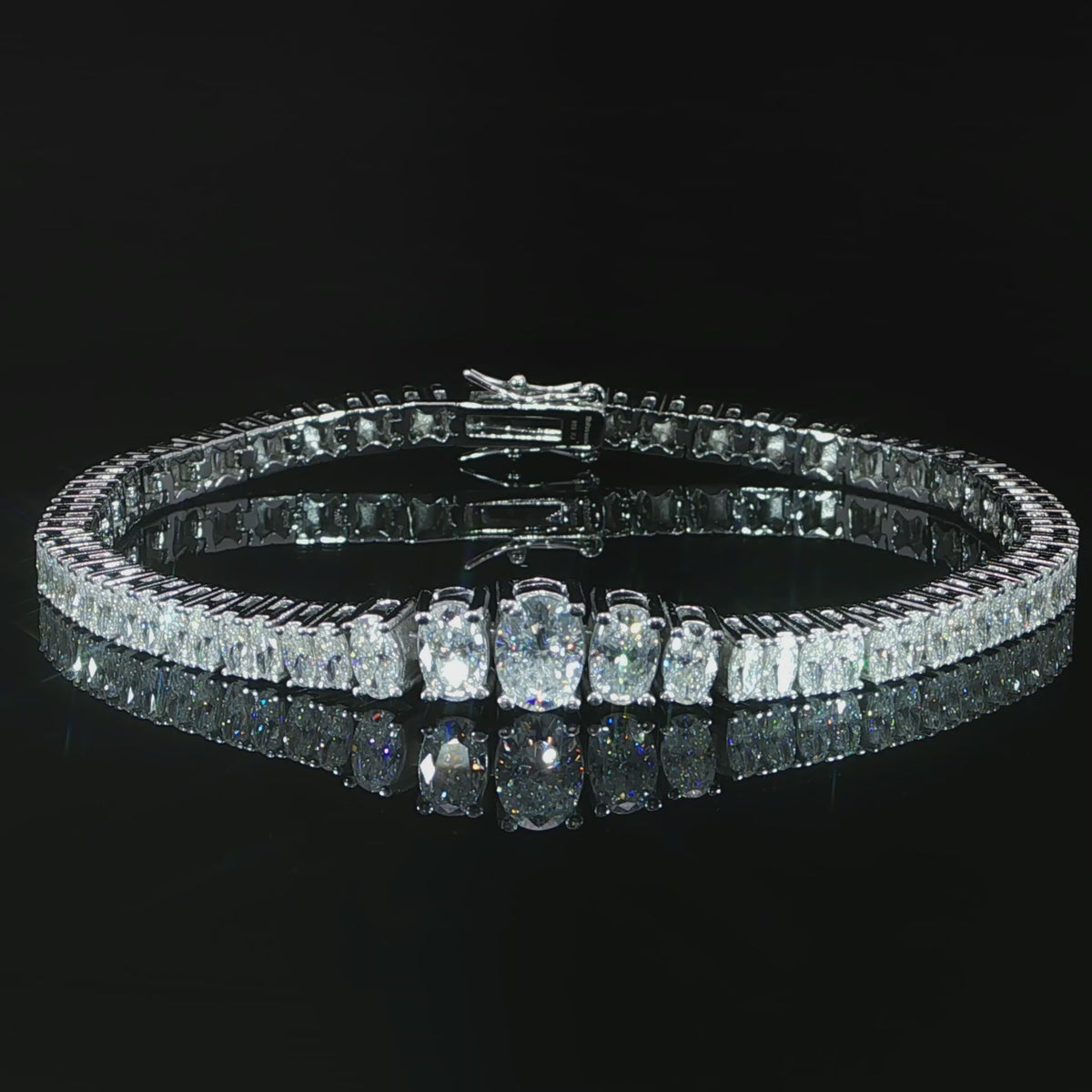 Video of sterling silver luxury graduated oval moissanite tennis bracelet