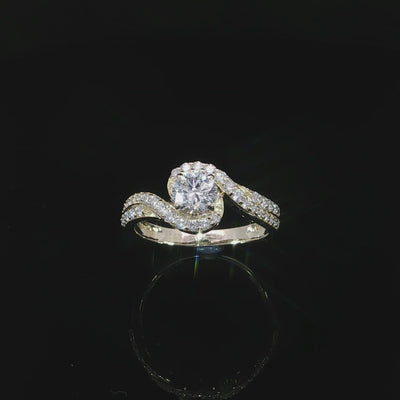 Round diamond engagement ring with a swirling pavé-set band in polished 14K yellow gold.