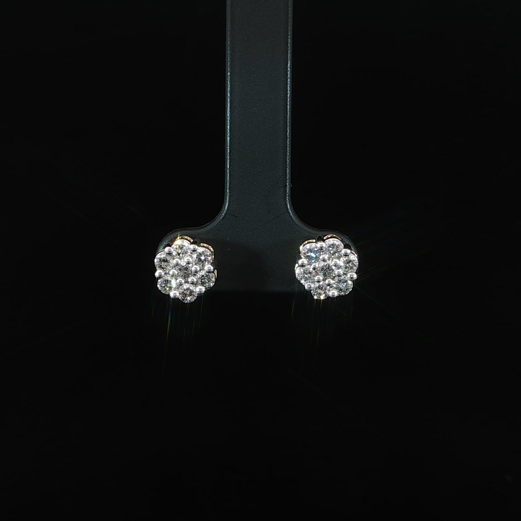 Pair of 10K yellow gold floral natural diamond stud earrings