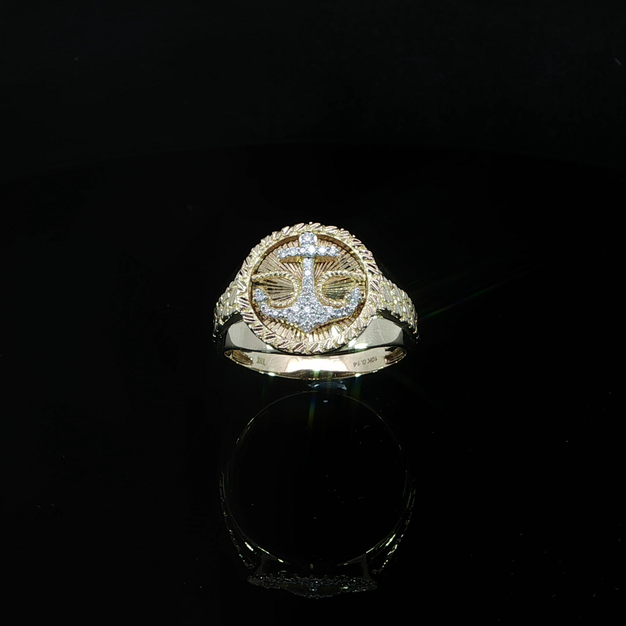 Detailed men's 10K gold nautical ring featuring a natural diamond anchor