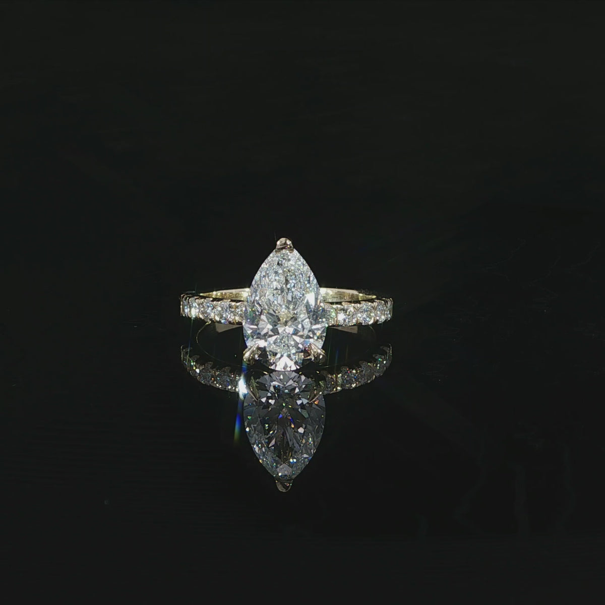 Pear-shaped engagement ring with 2.50 total carats of lab-grown diamonds in 14K yellow gold.