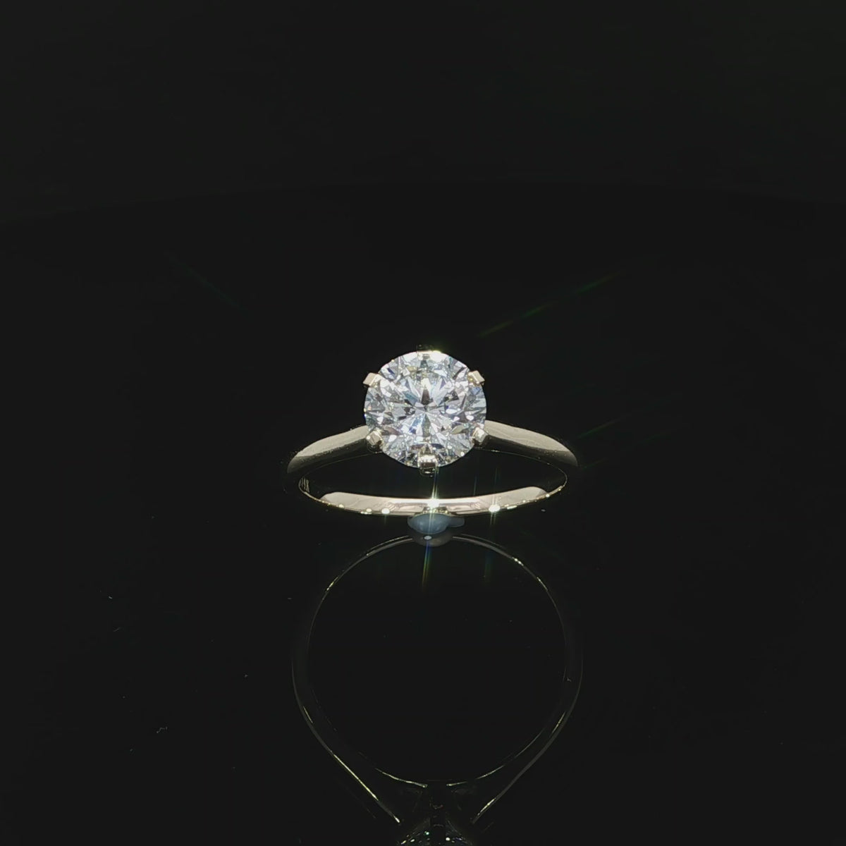 Round diamond 1.50ct in a six-prong setting with polished 14k yellow gold shank