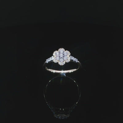 Angled video of 10K yellow gold 0.14 CTW diamond promise ring showing its flower design and shoulder accents.