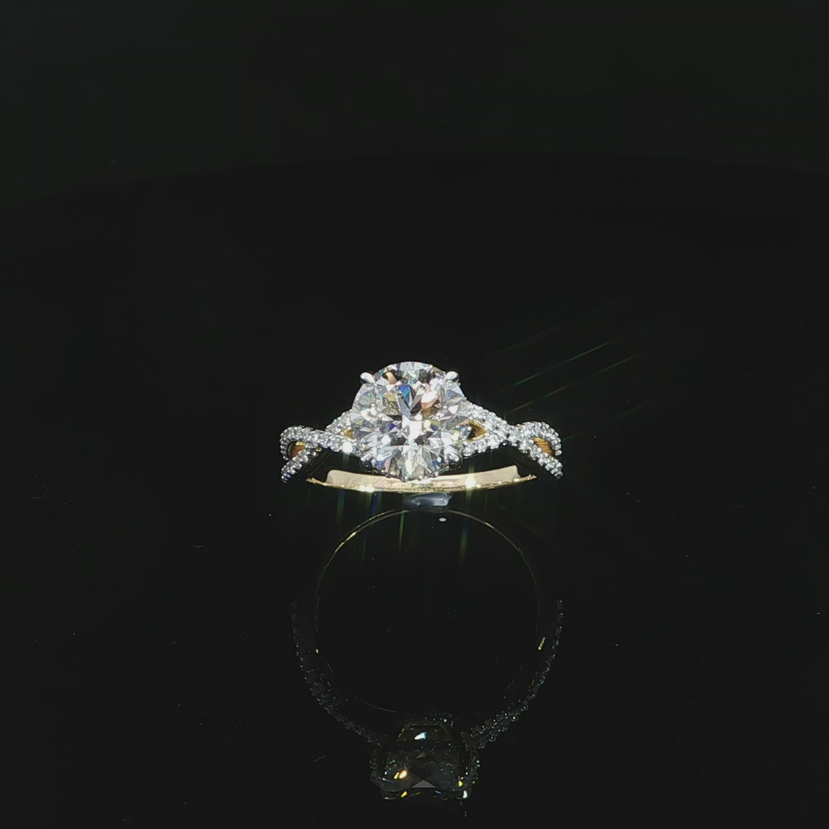 Yellow gold engagement ring featuring an E color, VS1 clarity round lab-grown center diamond.