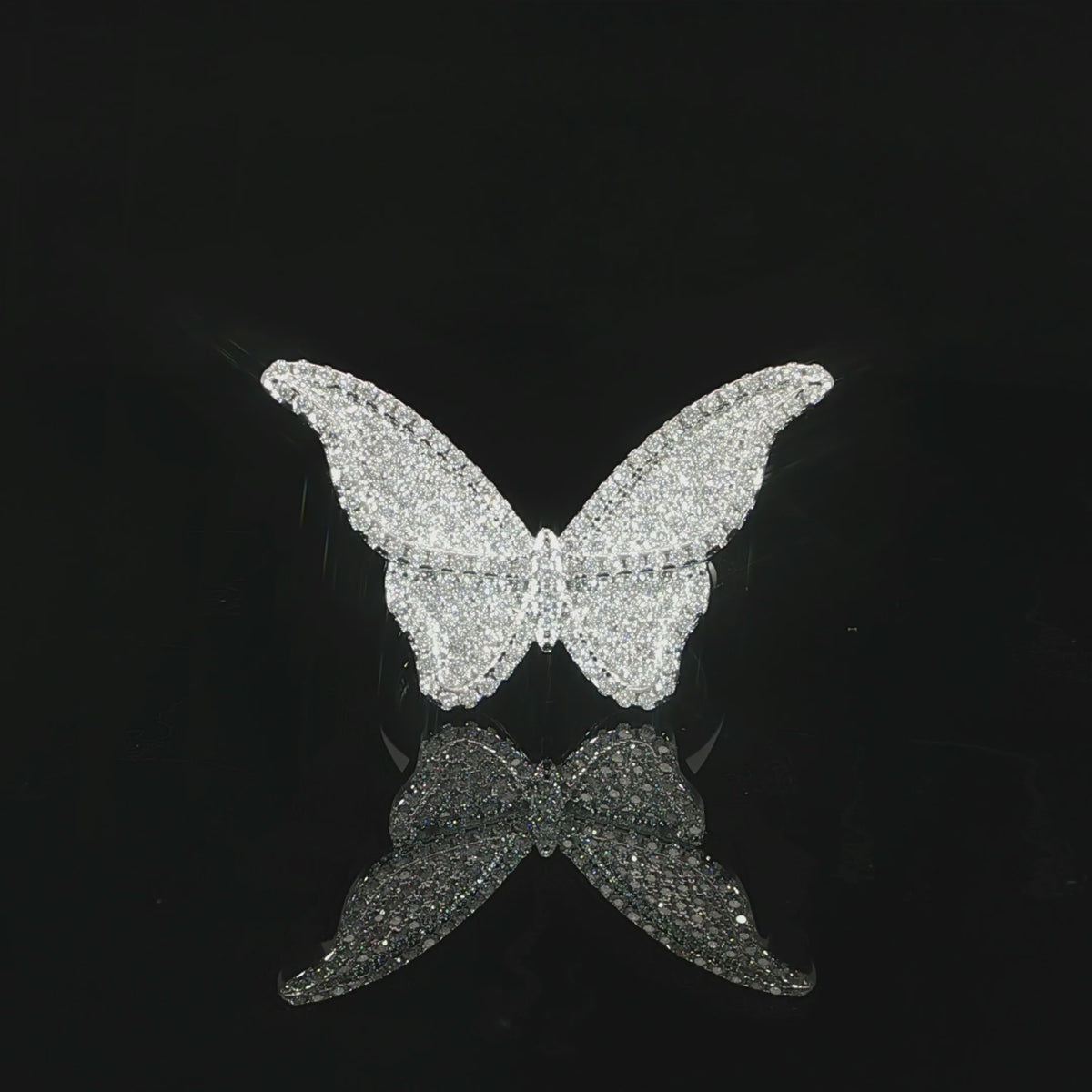 Nature-inspired sterling silver ring featuring a dimensional butterfly with fully spread wings.
