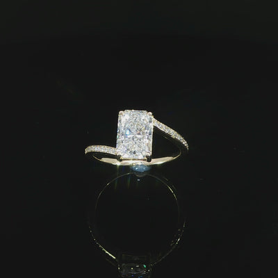 14K yellow gold radiant cut bypass engagement ring with 2 CT lab grown diamond and pavé band totaling 2.15 CTW