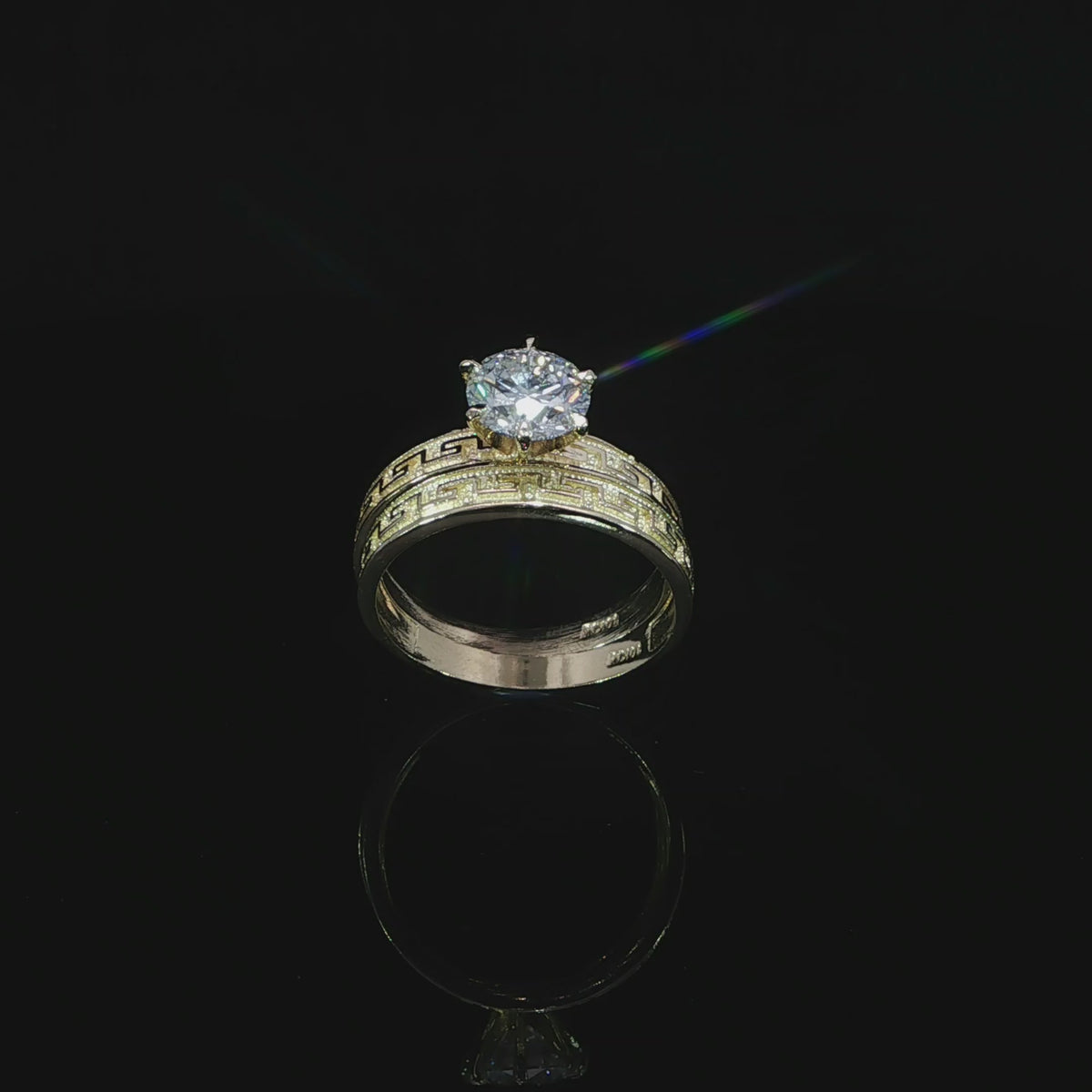 10K yellow gold ring set tilted to show the Greek key pattern, polished interiors and 1.21 CT round diamond.