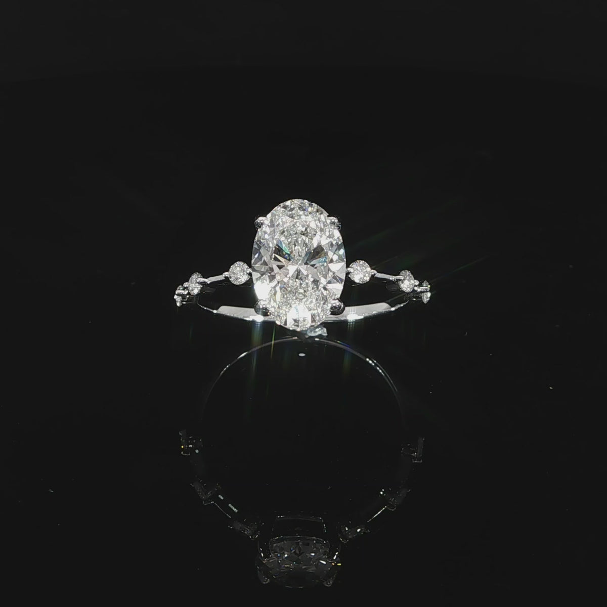 14K gold oval ring with subtle diamond station detailing