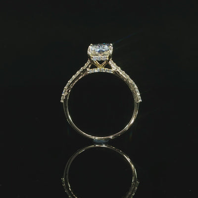 Radiant lab-grown diamond ring in yellow gold photographed against a black background