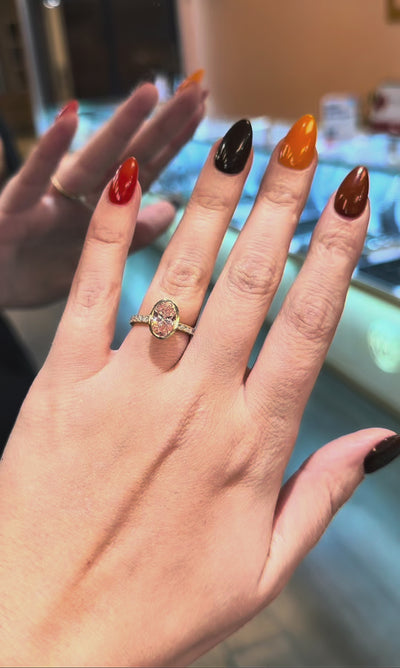 Video of fancy vivid pink oval diamond ring in bezel setting