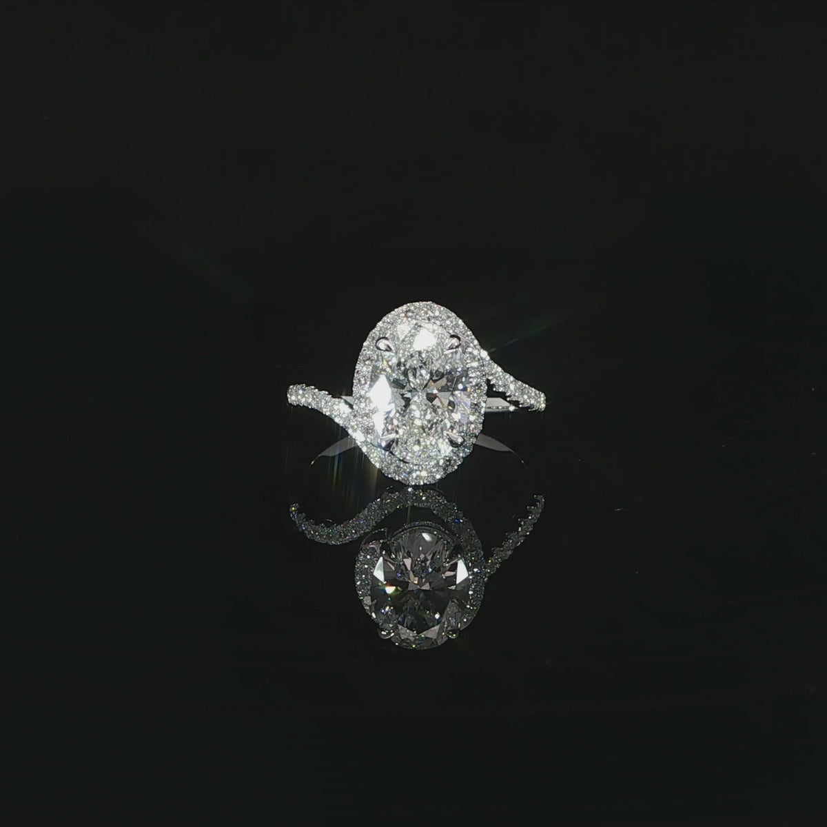 Video of oval halo engagement ring with 2.41 total carats of lab-grown diamonds in 14K white gold.