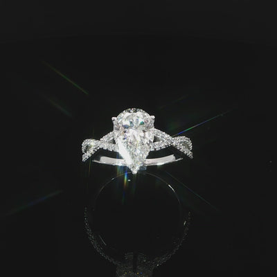 Engagement ring featuring an E color, VS1 clarity pear-shaped lab-grown diamond with a hidden halo.