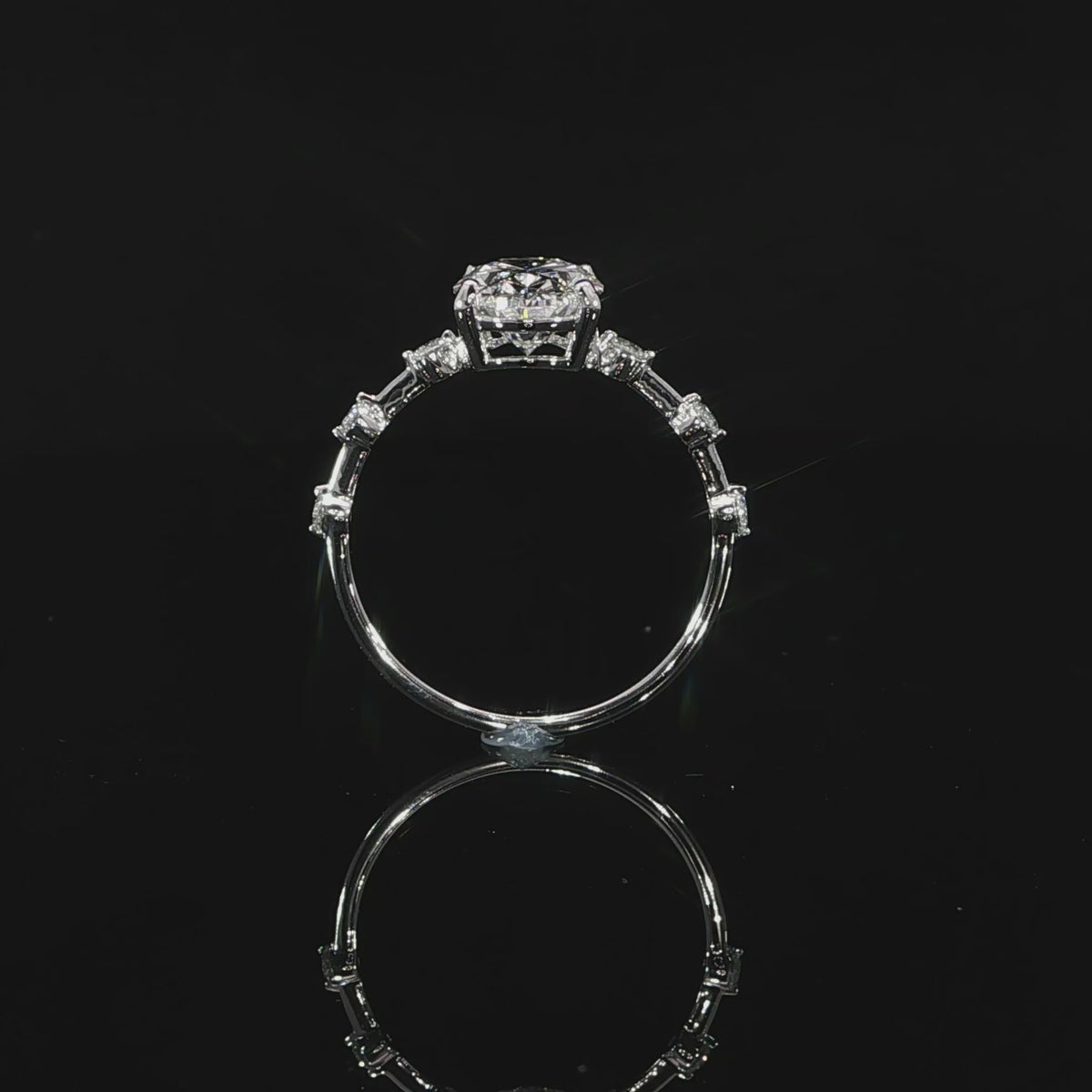 Detailed video of the setting supporting the 2-carat oval center diamond.
