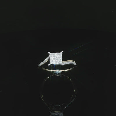 Upright video of a 10K yellow gold cluster ring with a diamond-accented shoulder and open setting.