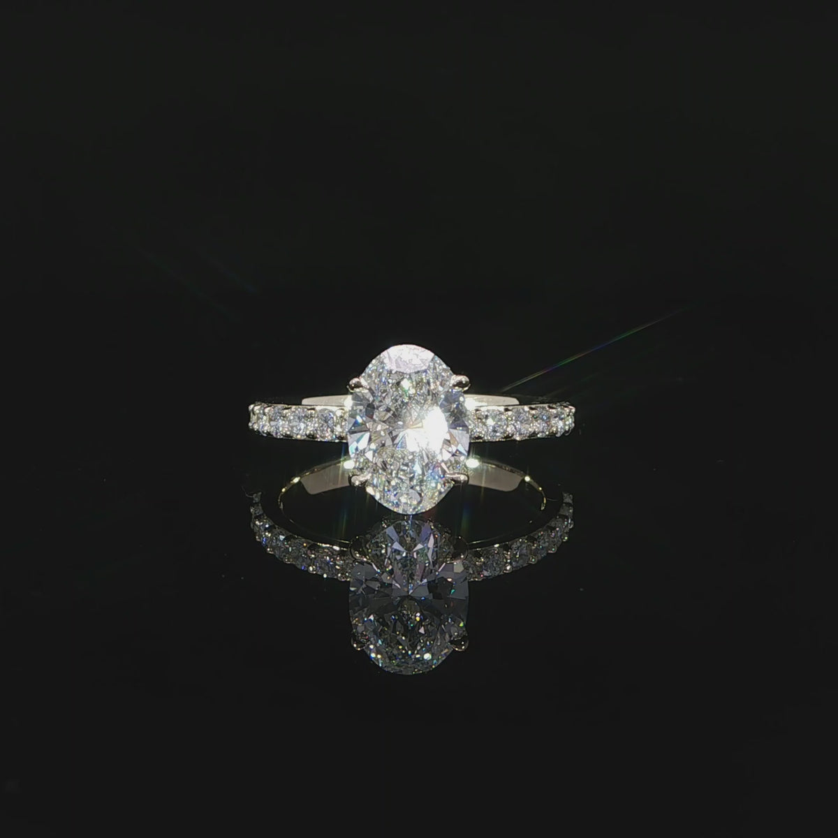 Video of oval engagement ring with 2.59 total carats of lab-grown diamonds in 14K yellow gold.