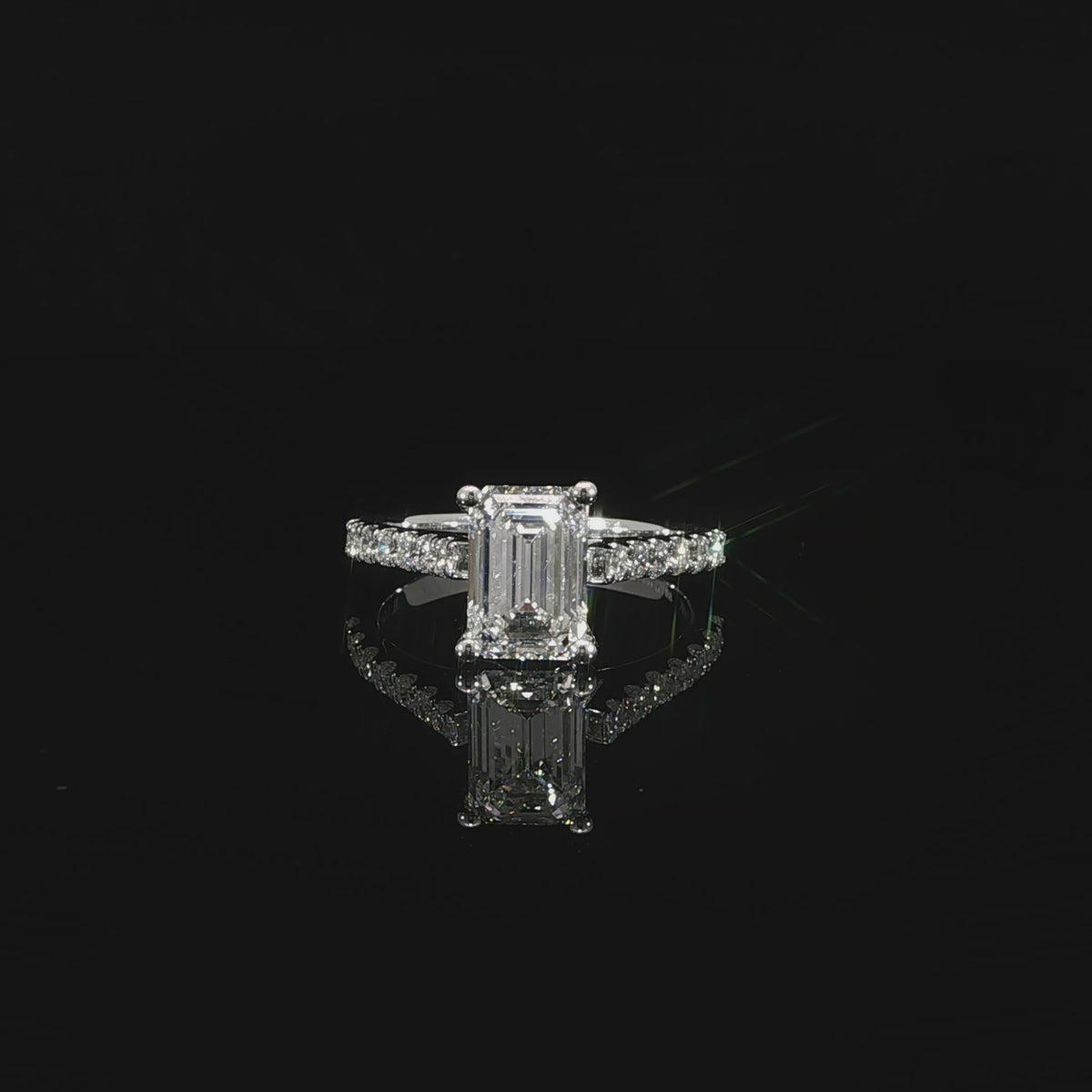 14K white gold engagement ring featuring a 2.08 carat G color VS1 emerald cut lab grown diamond.