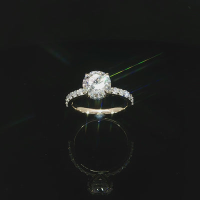 Angled view of a 14K yellow gold engagement ring with a 2.10-carat round center diamond.