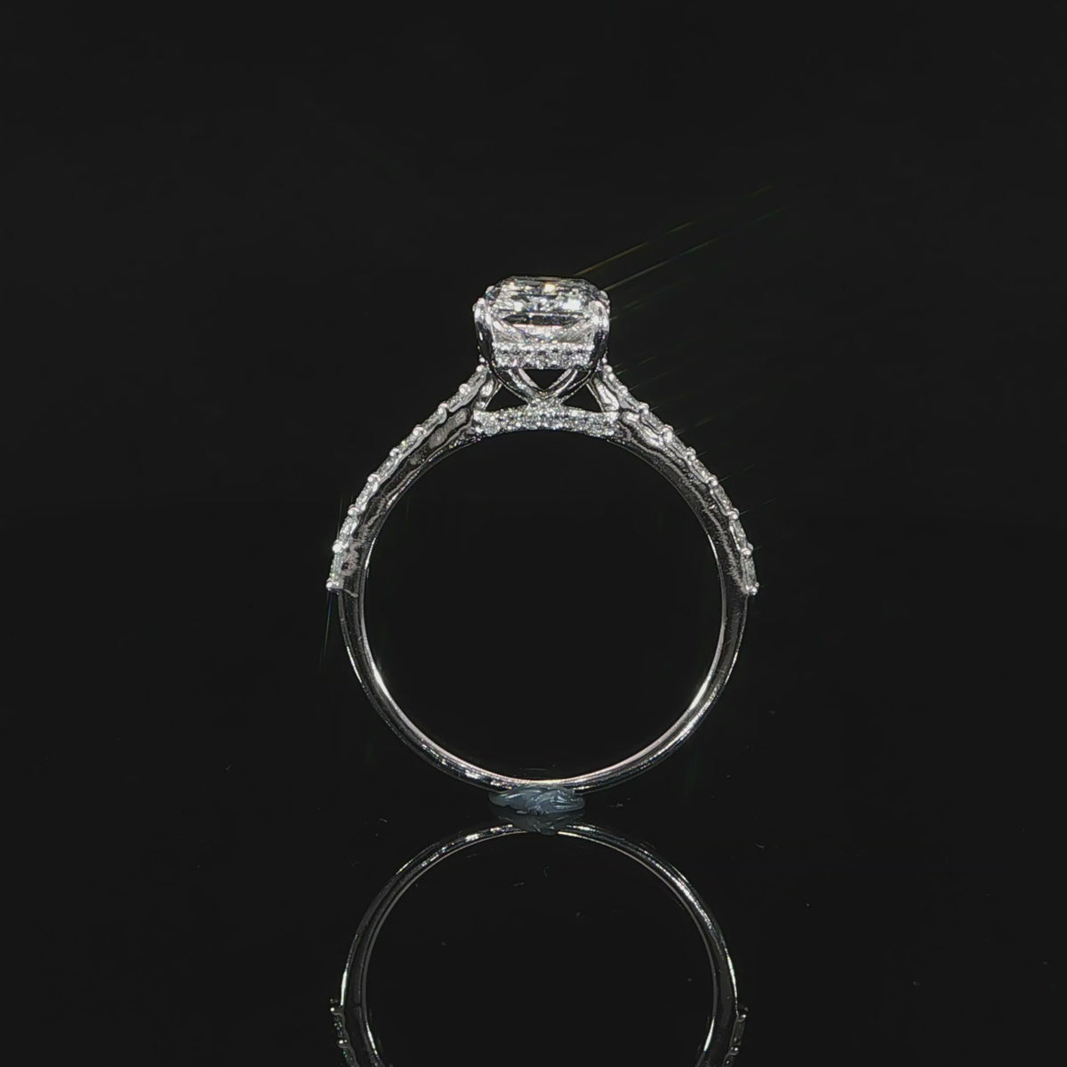 Close-up of the gallery, prongs and hidden halo around the radiant diamond.