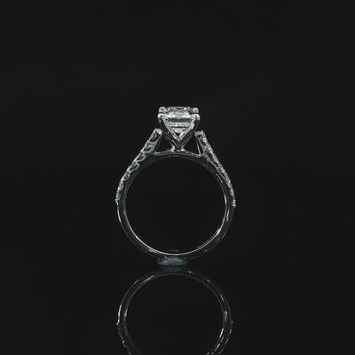 Side video of a 2 carat emerald cut diamond engagement ring with a pavé band and elevated center stone.