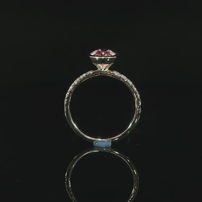 14k yellow gold fancy vivid pink oval diamond with a hidden halo and pave diamond band