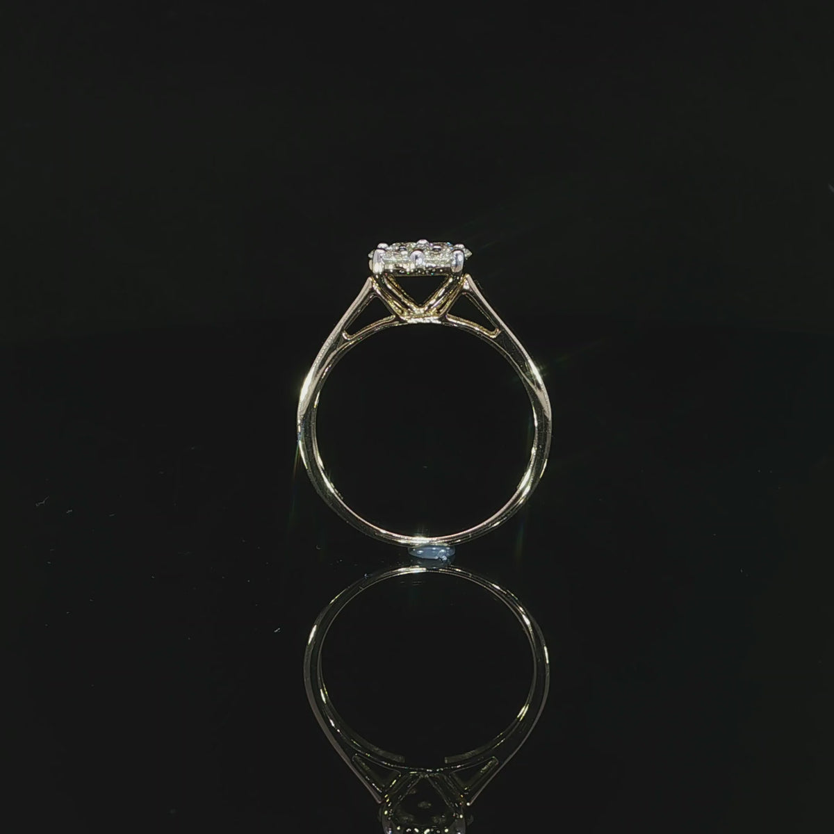 Profile of a 10K yellow gold 0.50 CTW seven-stone diamond cluster ring showing its raised setting and open gallery.