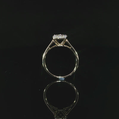 Profile of a 10K yellow gold 0.50 CTW seven-stone diamond cluster ring showing its raised setting and open gallery.