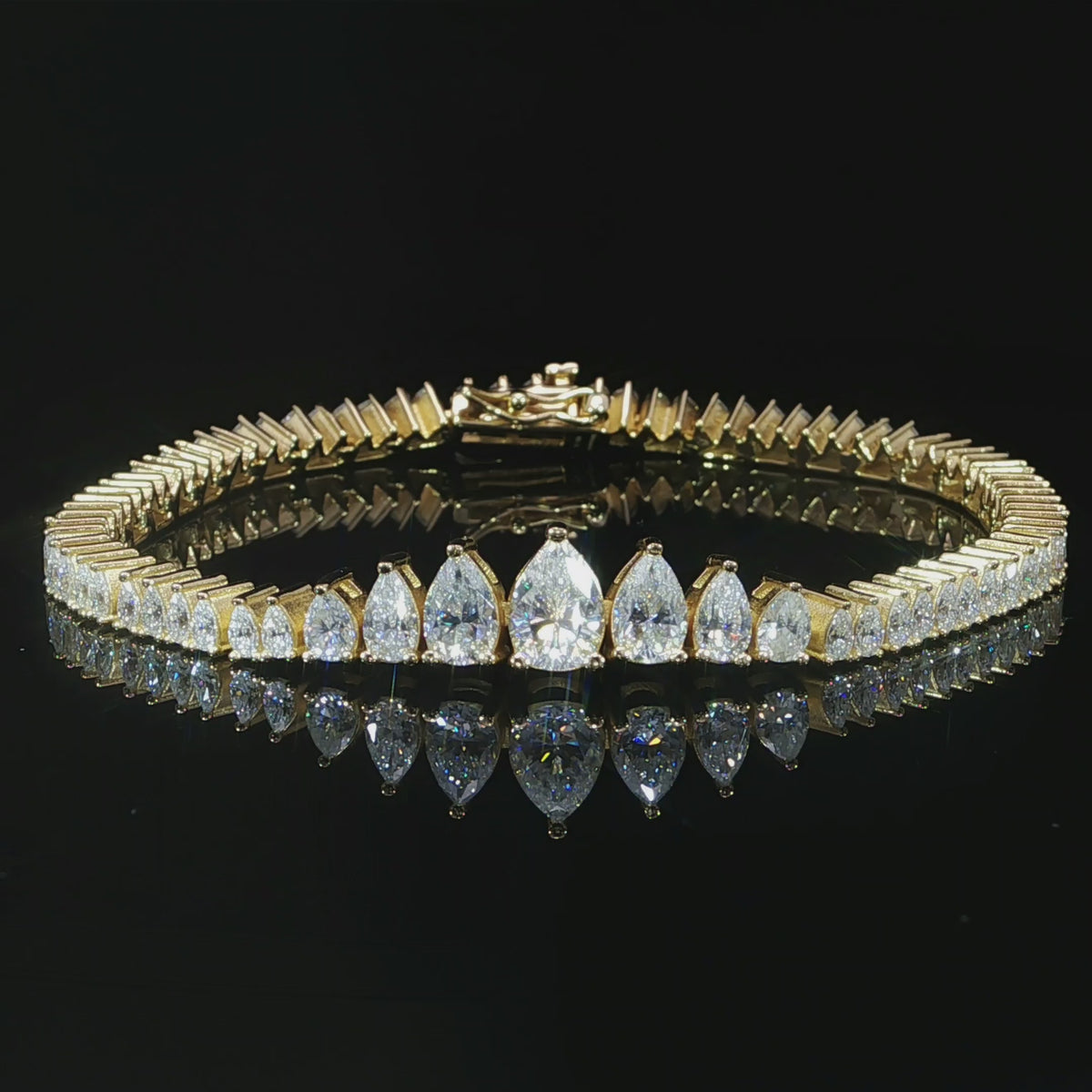 Pear moissanite bracelet graduating from 8 mm to 4 mm