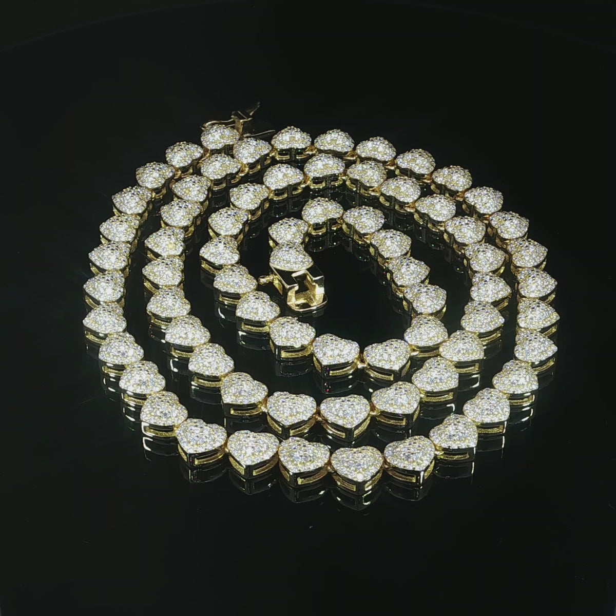 Petite heart halo tennis necklace featuring 10.20 CTW of VVS moissanite