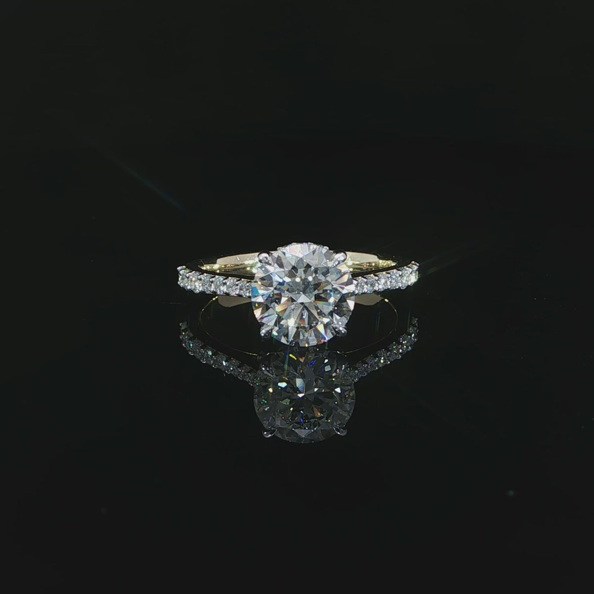 Yellow gold engagement ring featuring a D color, VS1 clarity round lab-grown center diamond.