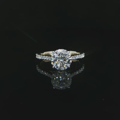 Yellow gold engagement ring featuring a D color, VS1 clarity round lab-grown center diamond.