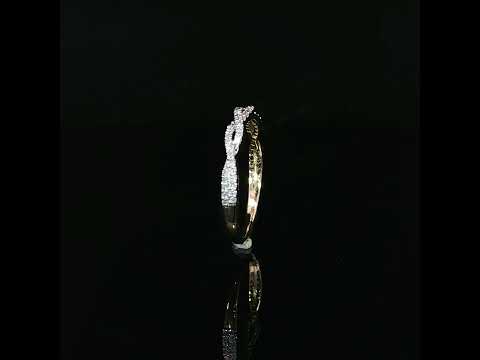 Side view of a 14K yellow gold diamond twist ring highlighting its openwork design, smooth polished shank, and sparkling diamond details.