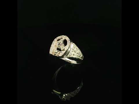Three-quarter view of a gold horseshoe statement ring highlighting raised scroll details on its tapered shoulder.