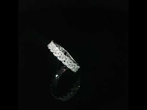 Diagonal video highlighting diamond-covered link shapes and openwork details in a white gold ring.