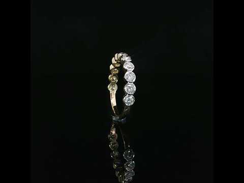 14K yellow gold diamond anniversary band with 0.87 CTW sparkling round lab grown diamonds in contemporary bezel settings.