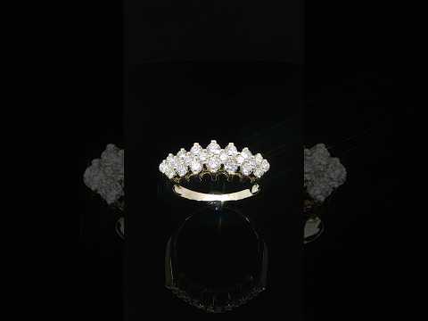 Upright profile of a multi-row diamond anniversary ring showing individual settings above a polished gold shank.