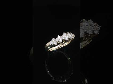 14K yellow gold ring showing its scalloped diamond cluster arrangement.