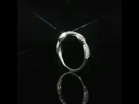  Detailed view of a 14K white gold twist band showcasing pavé-set lab grown diamonds and an elegant overlapping design.