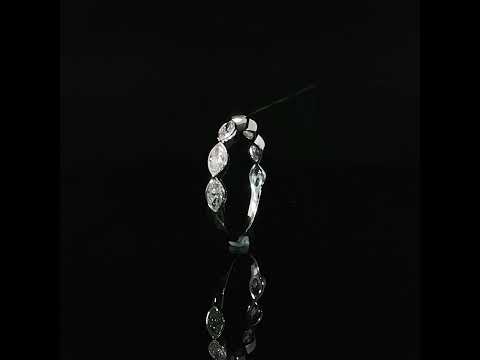 Side profile highlighting the individual marquise bezel settings of a 14K white gold diamond band.
