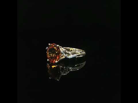 Front view of a 14K yellow gold ring with an oval natural citrine, four prongs, and 0.06 CTW diamonds.