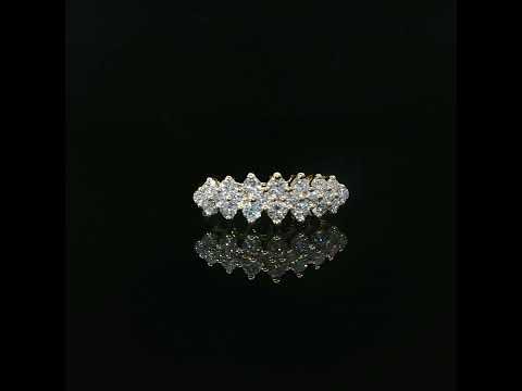 1.02 CTW lab-grown diamond band with staggered stones and visible gold prongs.